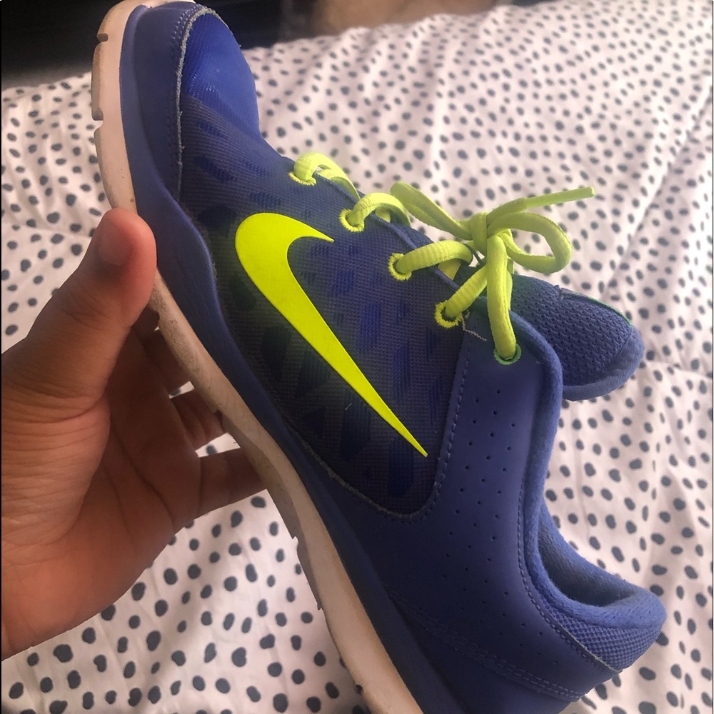 Blue and neon green NIKE running shoes.